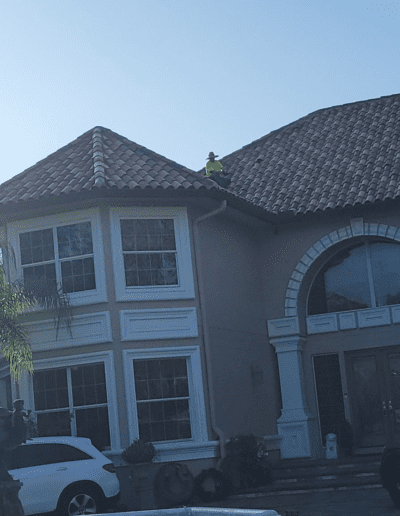 A house with a car parked in front of it.