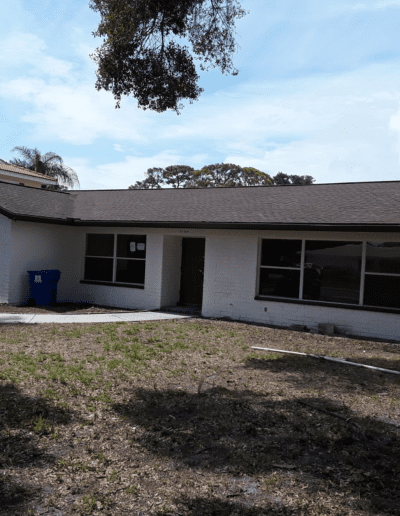 A house with a garage in front of it.