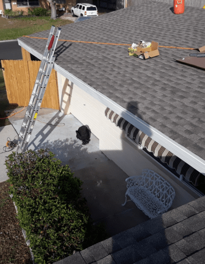 An aerial view of a roof with a ladder.