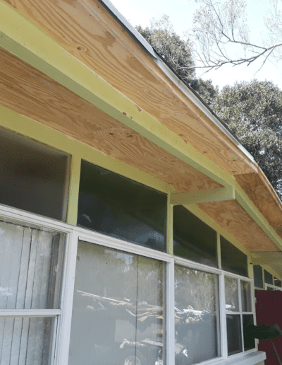 A house with a wooden roof and windows.