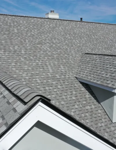 A house with a gray shingled roof.