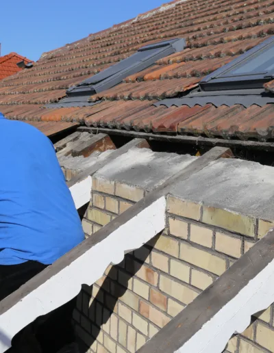 A man working on a roof.
